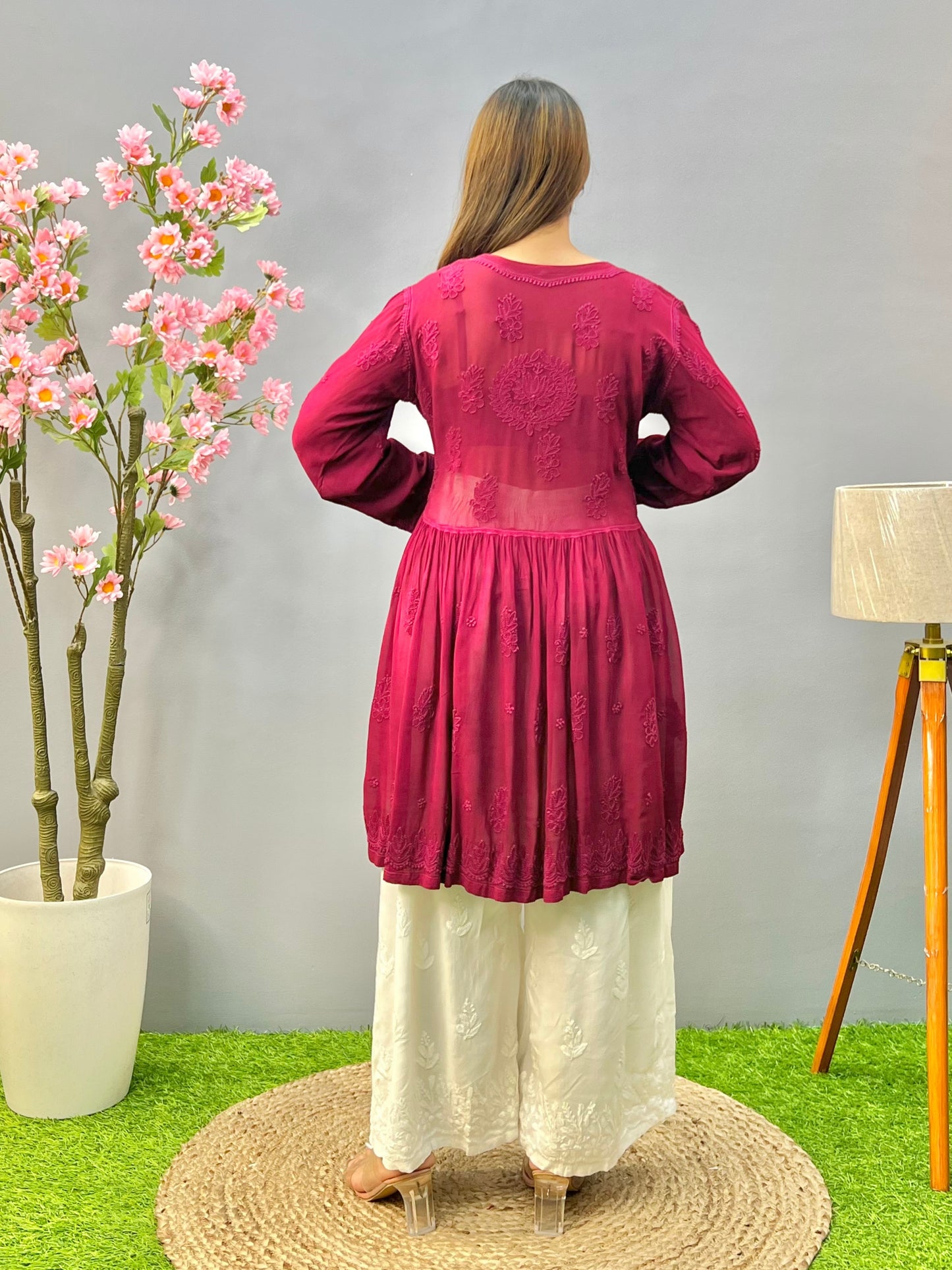 Woman wearing a premium wine red viscose Lucknowi Chikankari short frock with full sleeves and gathered waist, by R S CHIKANKARI.