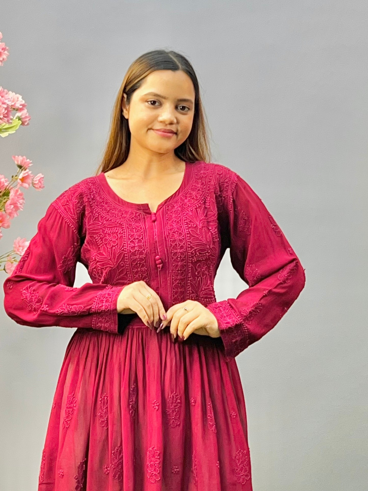 Woman wearing a premium wine red viscose Lucknowi Chikankari short frock with full sleeves and gathered waist, by R S CHIKANKARI.
