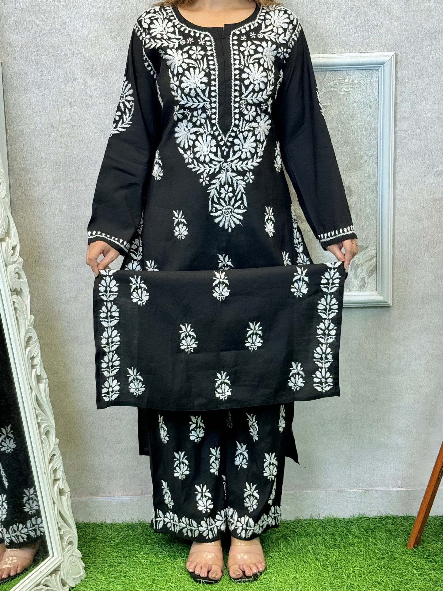 Black Roman silk Lucknow Chikankari kurta and palazzo set with white hand embroidery.