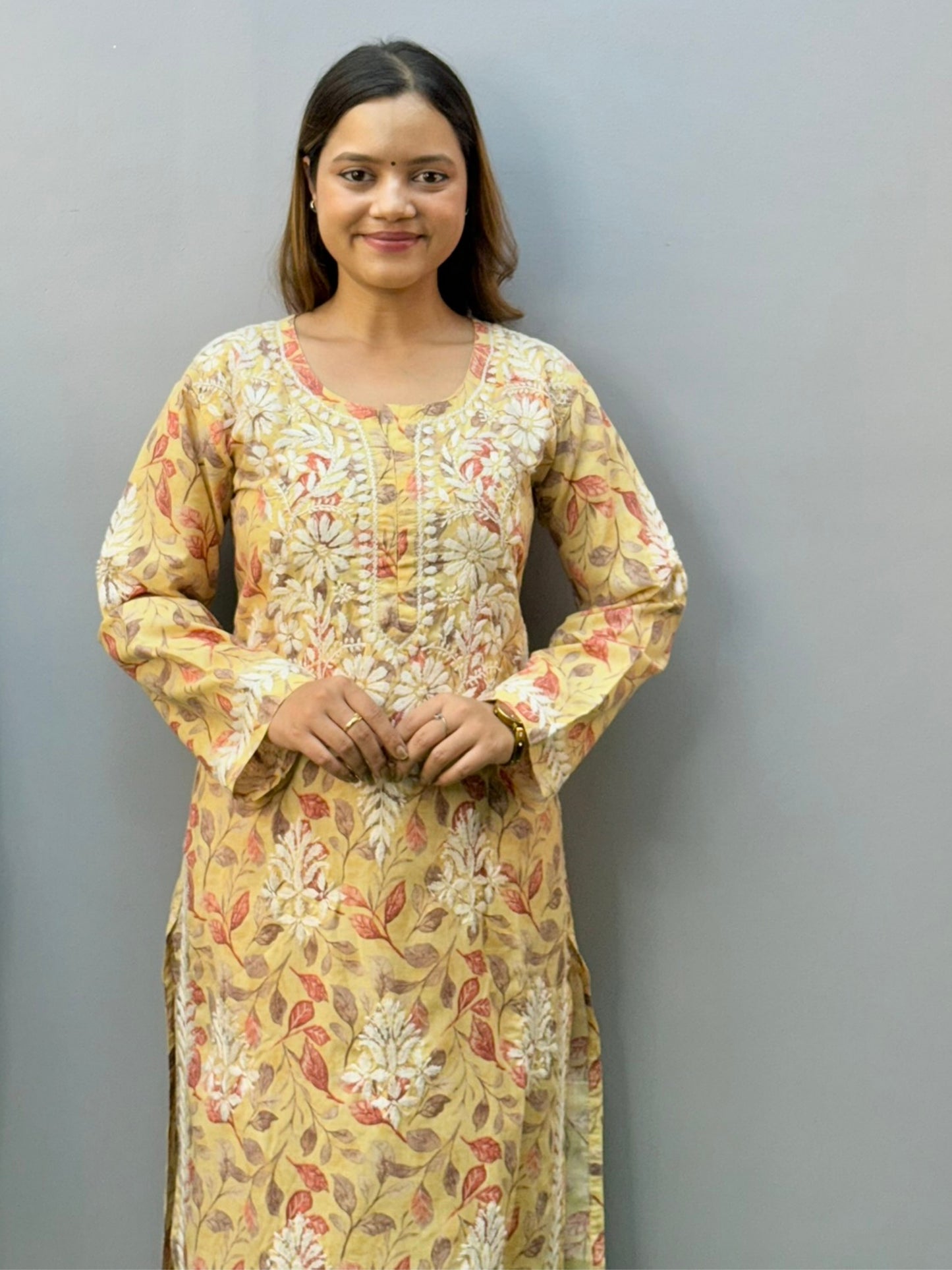 Mustard printed cotton chikankari kurta pant set with white hand embroidery and floral leaf pattern