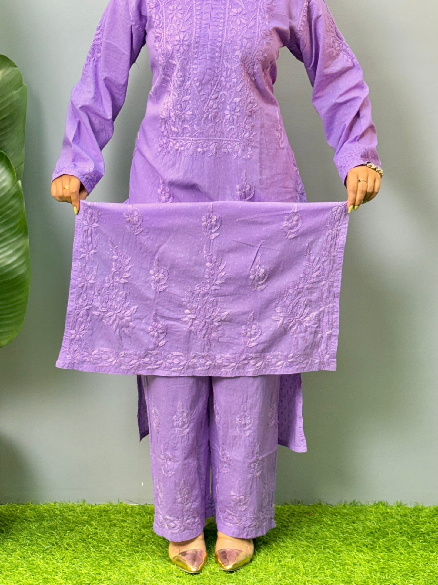 Model wearing lavender dobby cotton chikankari kurta and pant set