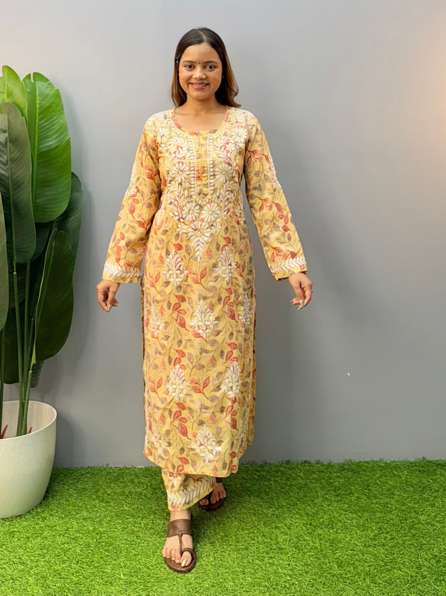 Mustard printed cotton chikankari kurta pant set with white hand embroidery and floral leaf pattern