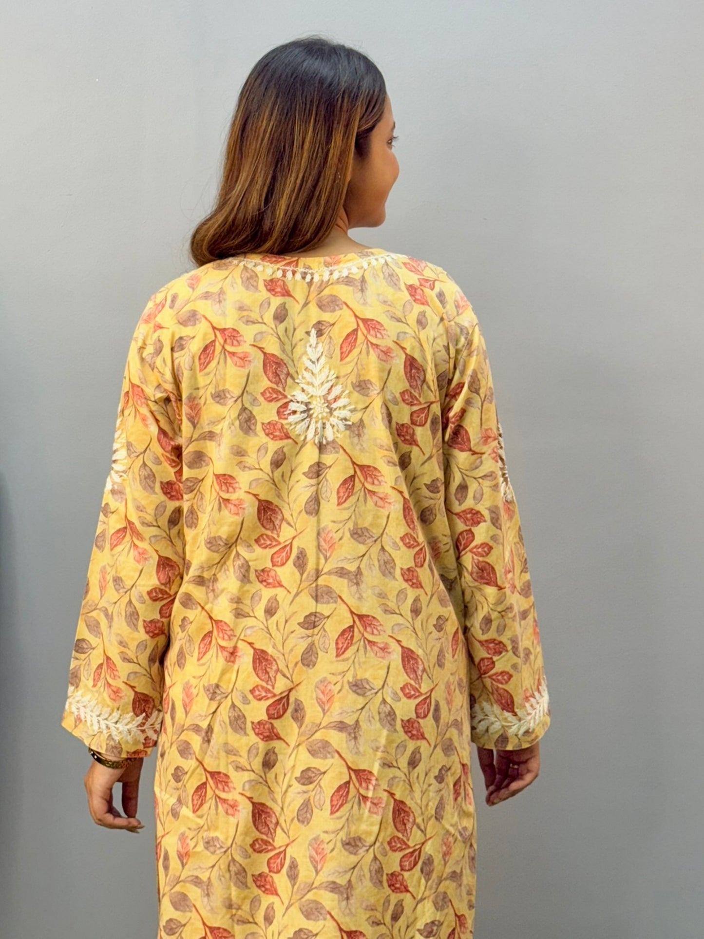Mustard printed cotton chikankari kurta pant set with white hand embroidery and floral leaf pattern