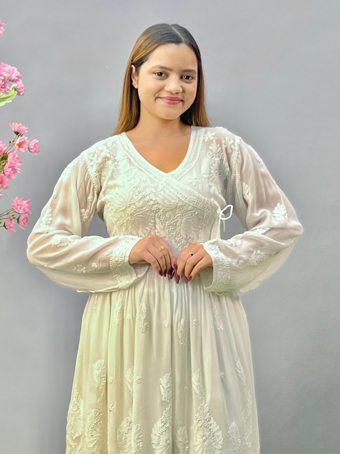 Woman wearing a premium white dyable viscose Lucknowi Chikankari short angrakha frock with full sleeves and tie-up detail, by R S CHIKANKARI.
