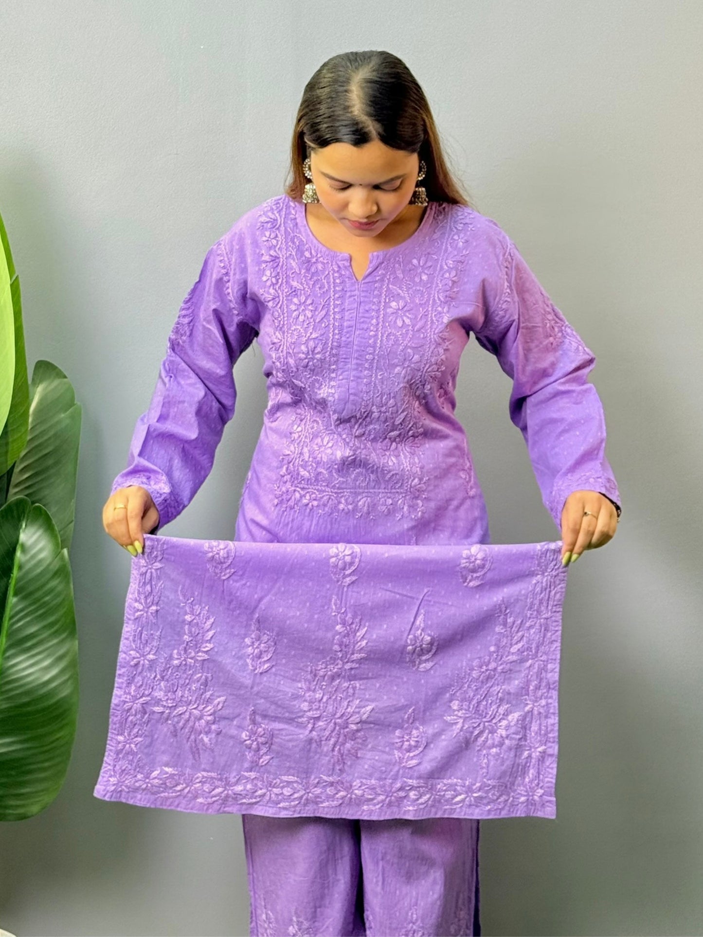 Model wearing lavender dobby cotton chikankari kurta and pant set
