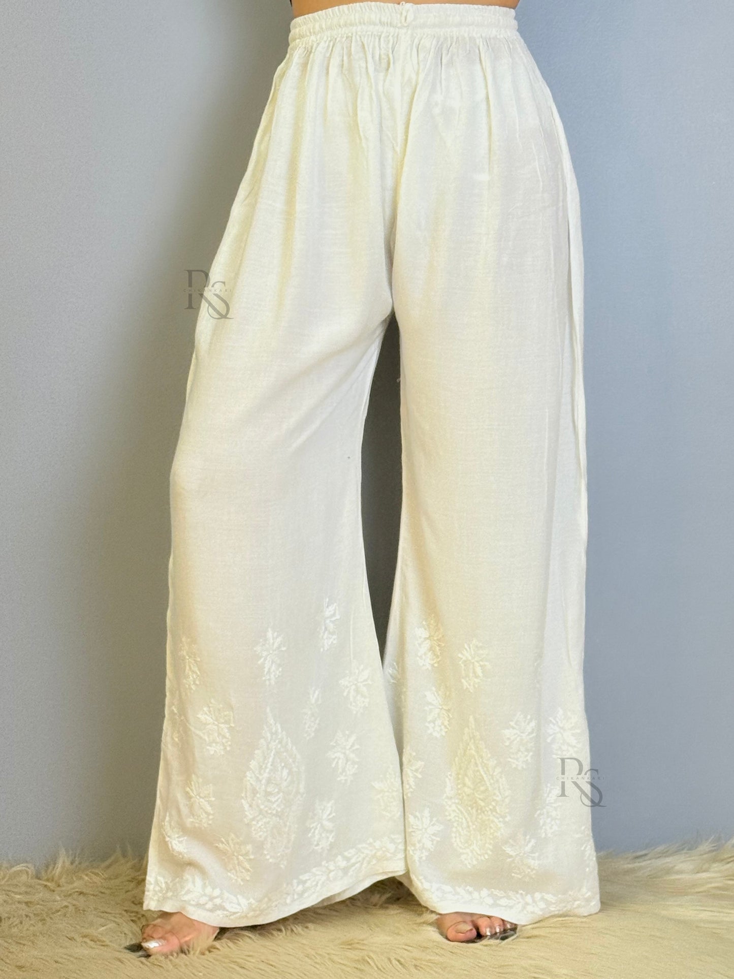 White rayon chikankari palazzo with wide-leg design and hem embroidery