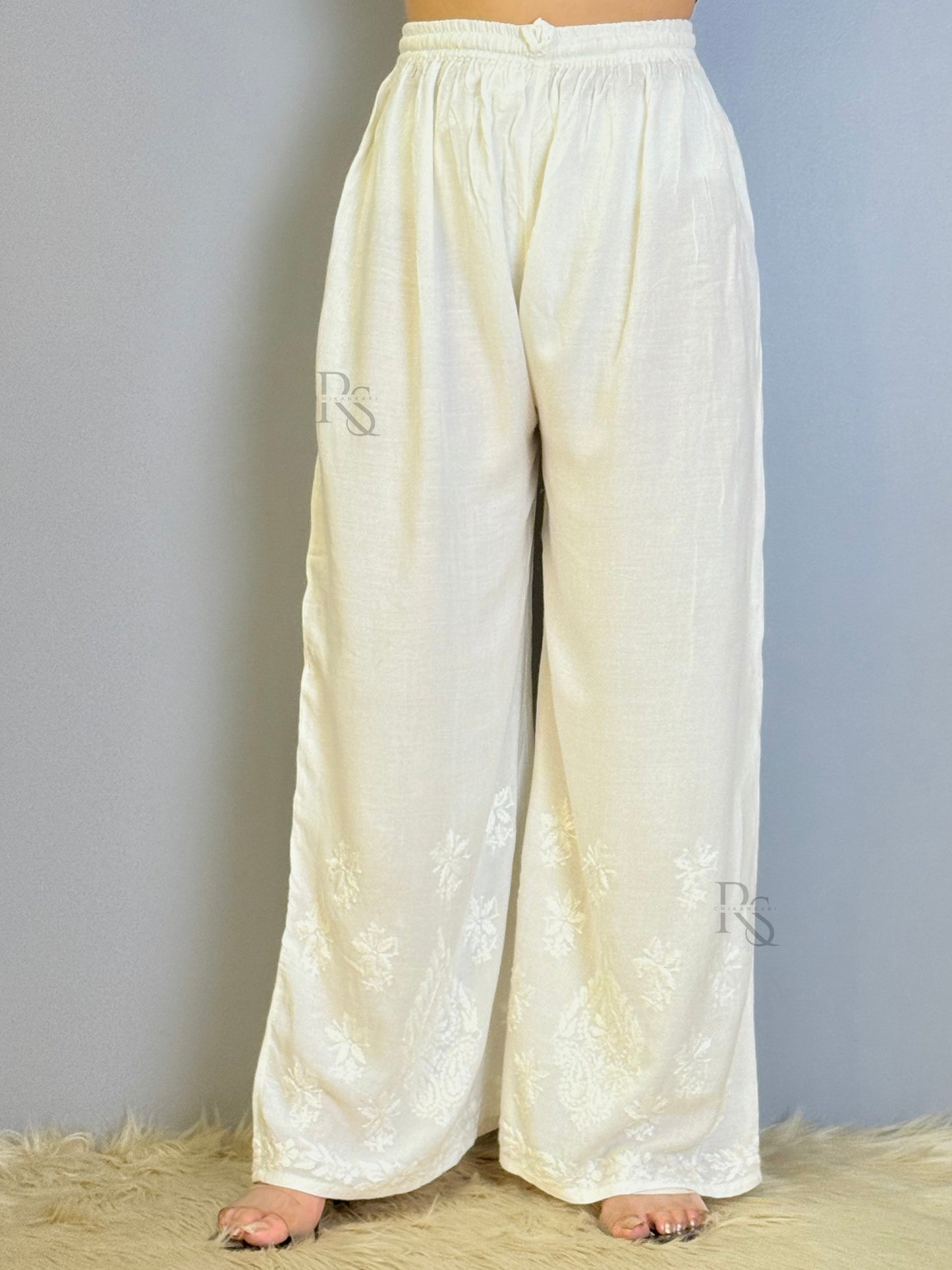 White rayon chikankari palazzo with wide-leg design and hem embroidery