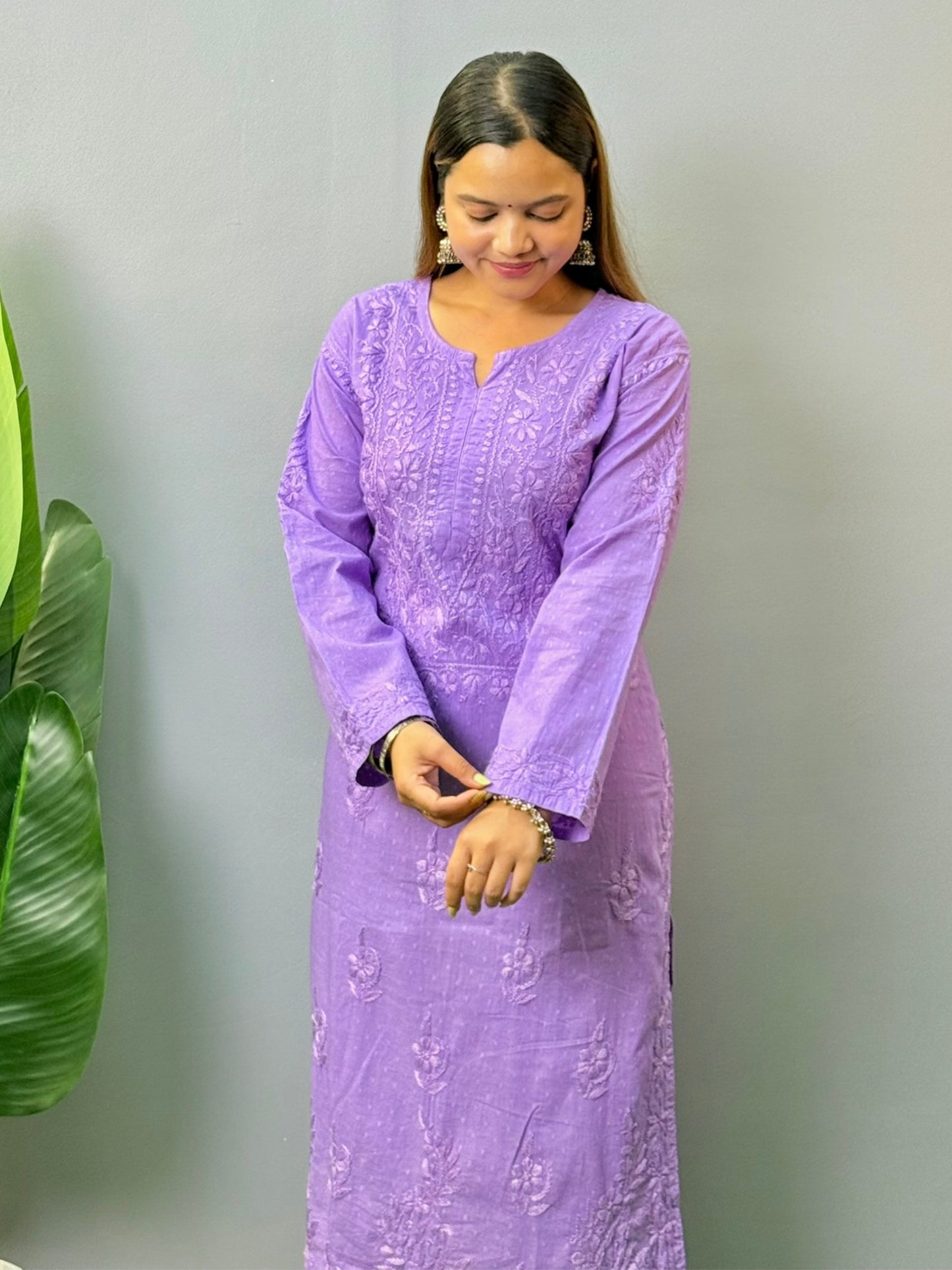 Model wearing lavender dobby cotton chikankari kurta and pant set