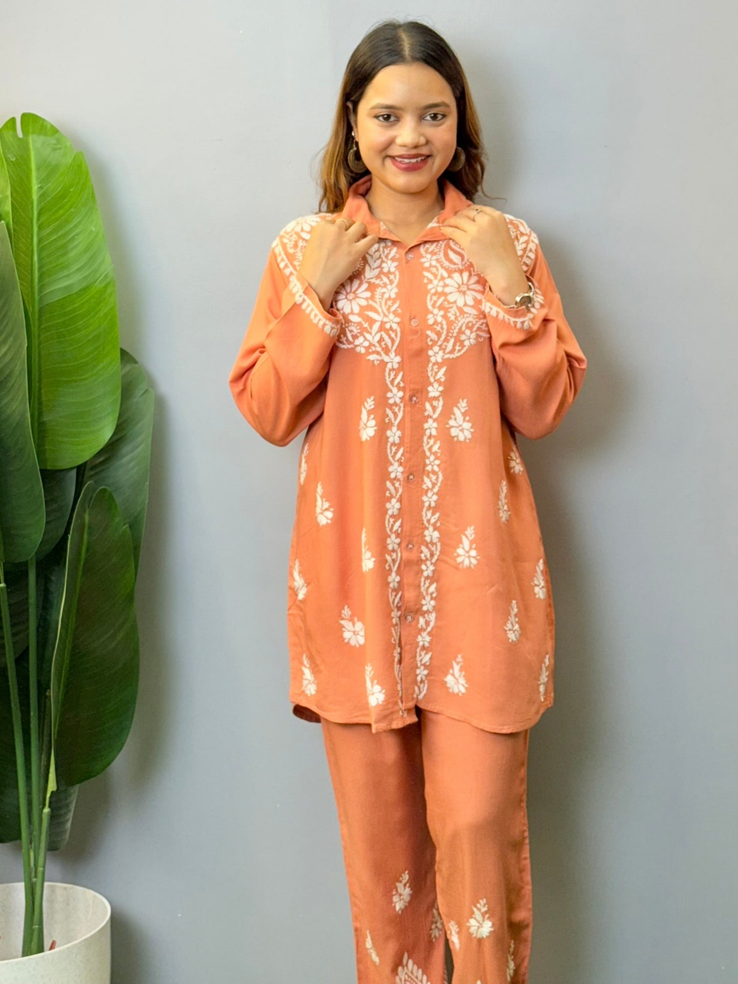 Terracotta Lucknowi chikankari short kurta and pant set in rayon fabric with white hand embroidery