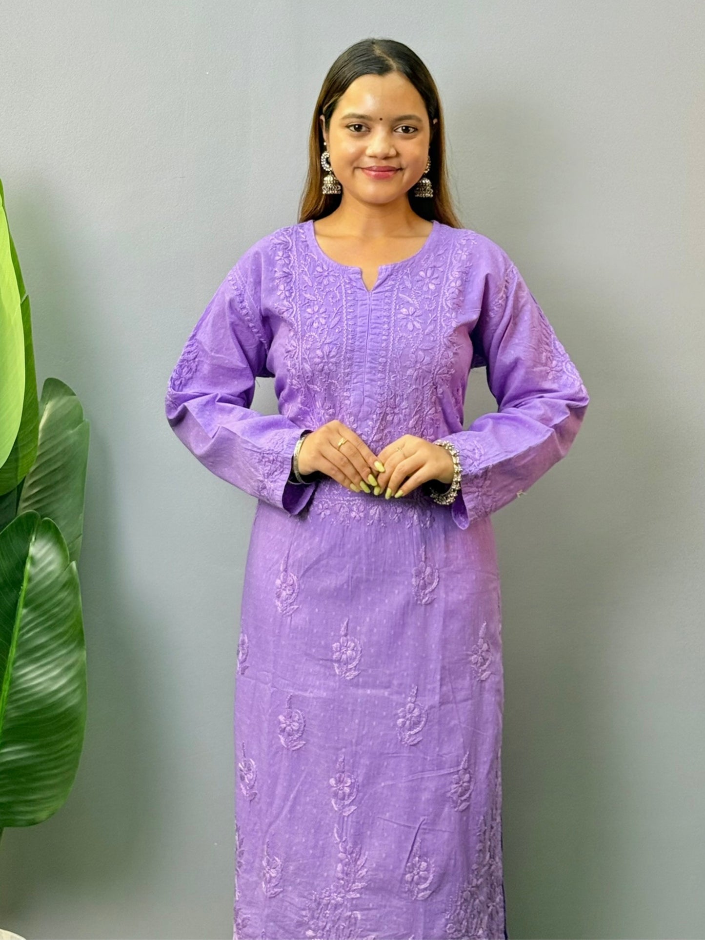 Model wearing lavender dobby cotton chikankari kurta and pant set