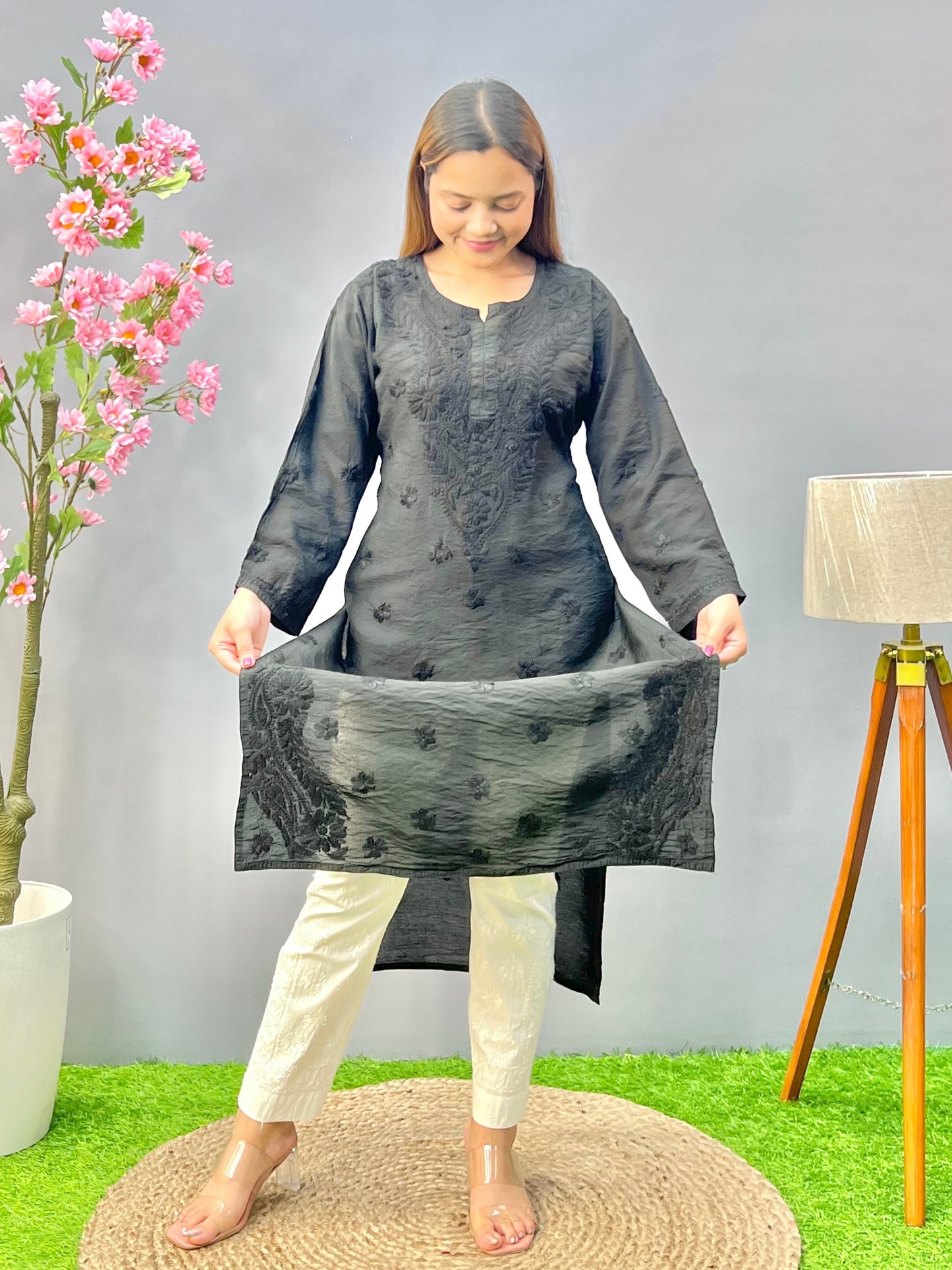 Woman wearing a premium classic black Chanderi Lucknowi Chikankari straight cut kurta with tone-on-tone embroidery, full sleeves, by R S CHIKANKARI.