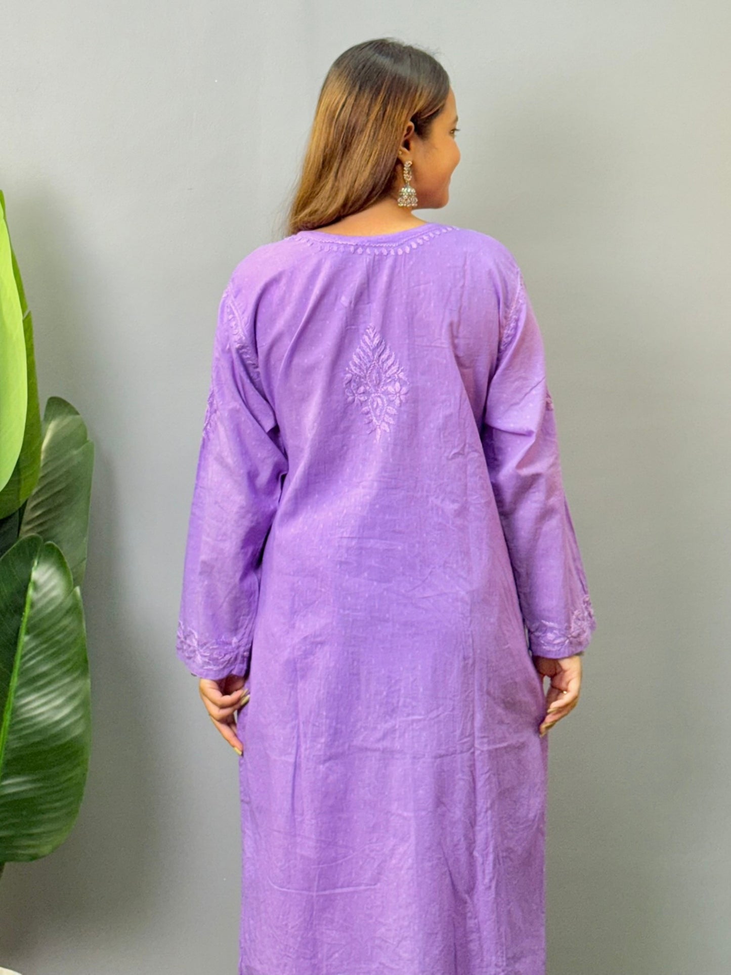 Model wearing lavender dobby cotton chikankari kurta and pant set