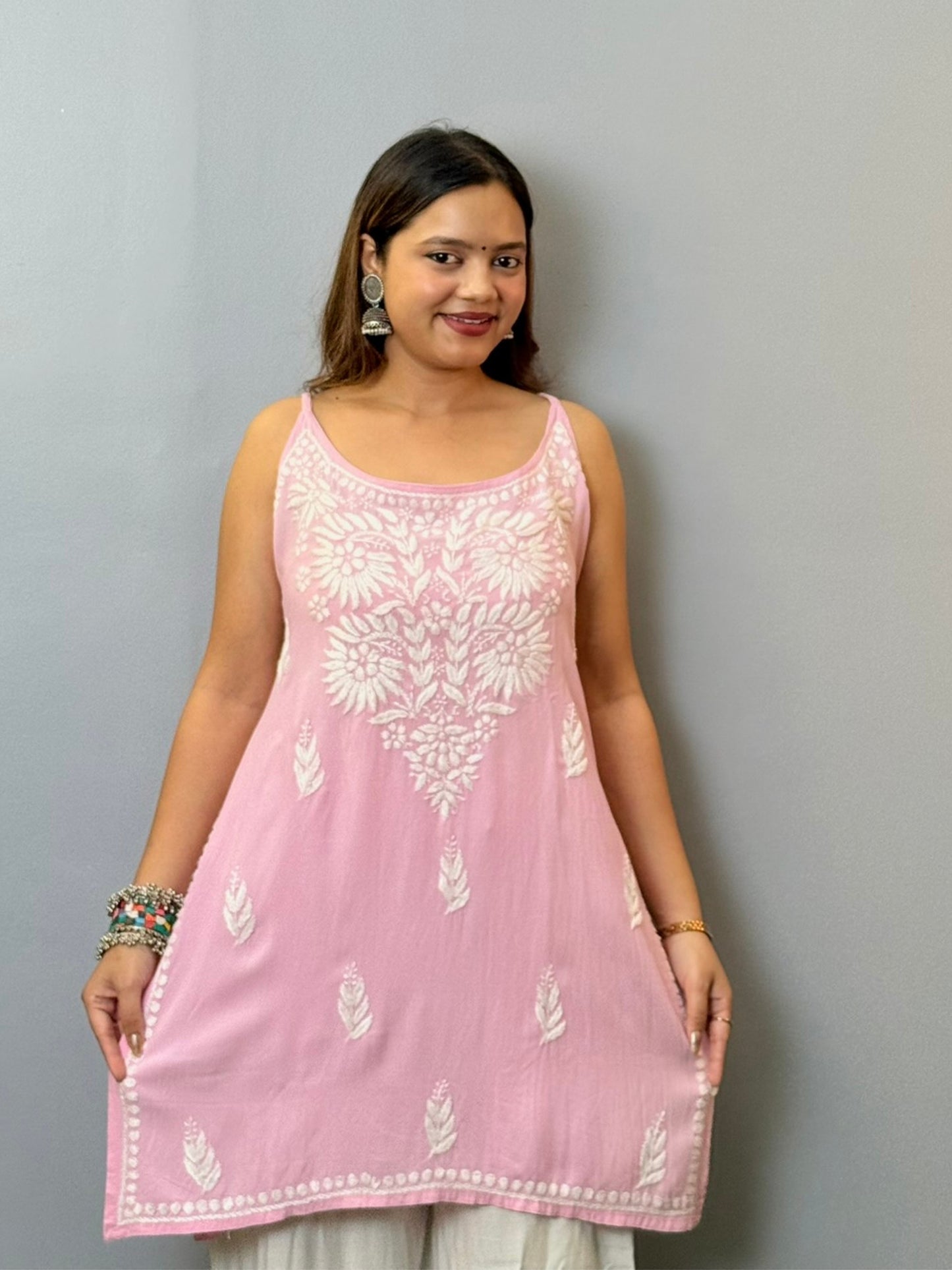 Baby pink sleeveless rayon Lucknowi Chikankari short kurta with white hand embroidery