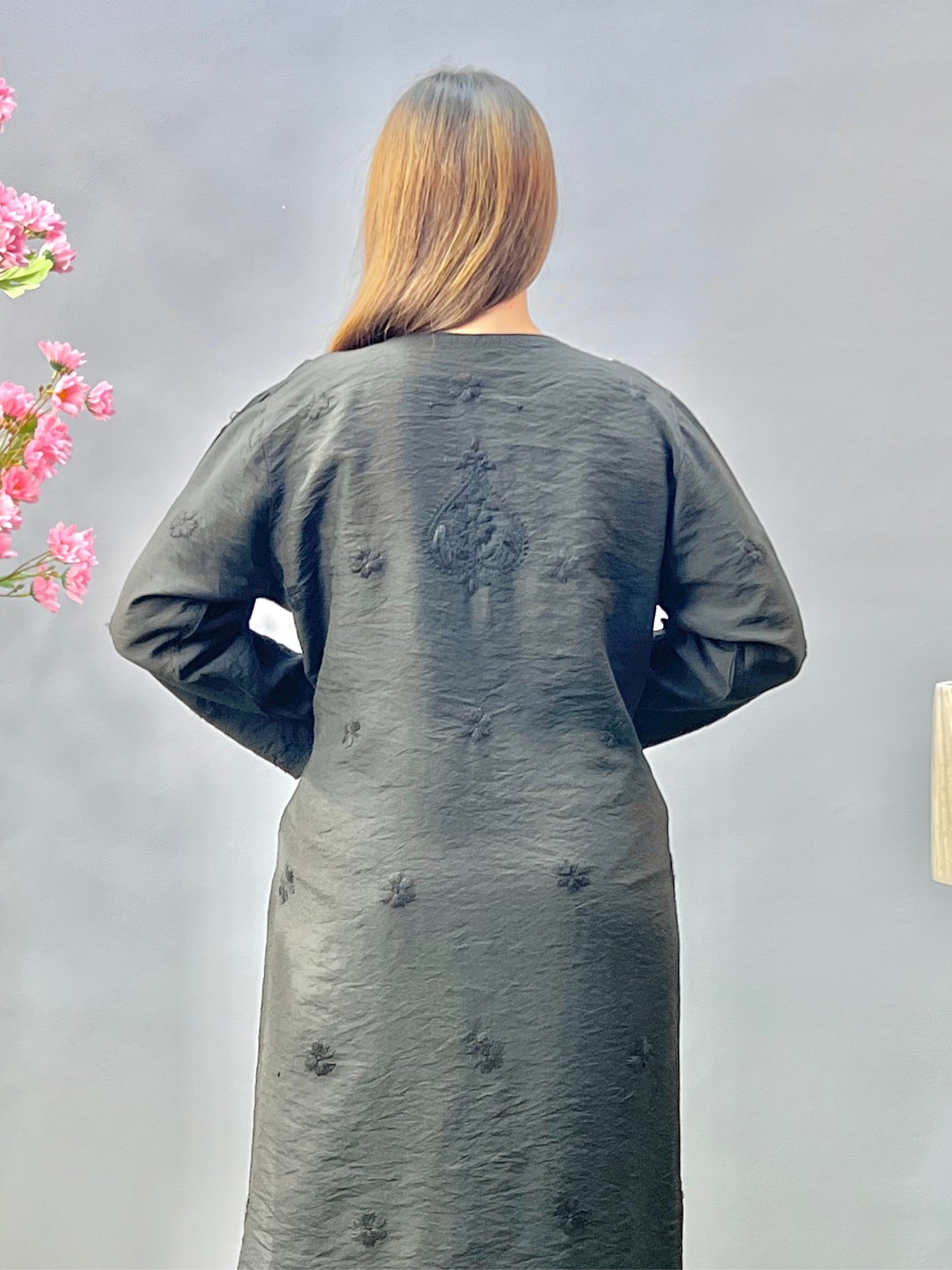 Woman wearing a premium classic black Chanderi Lucknowi Chikankari straight cut kurta with tone-on-tone embroidery, full sleeves, by R S CHIKANKARI.