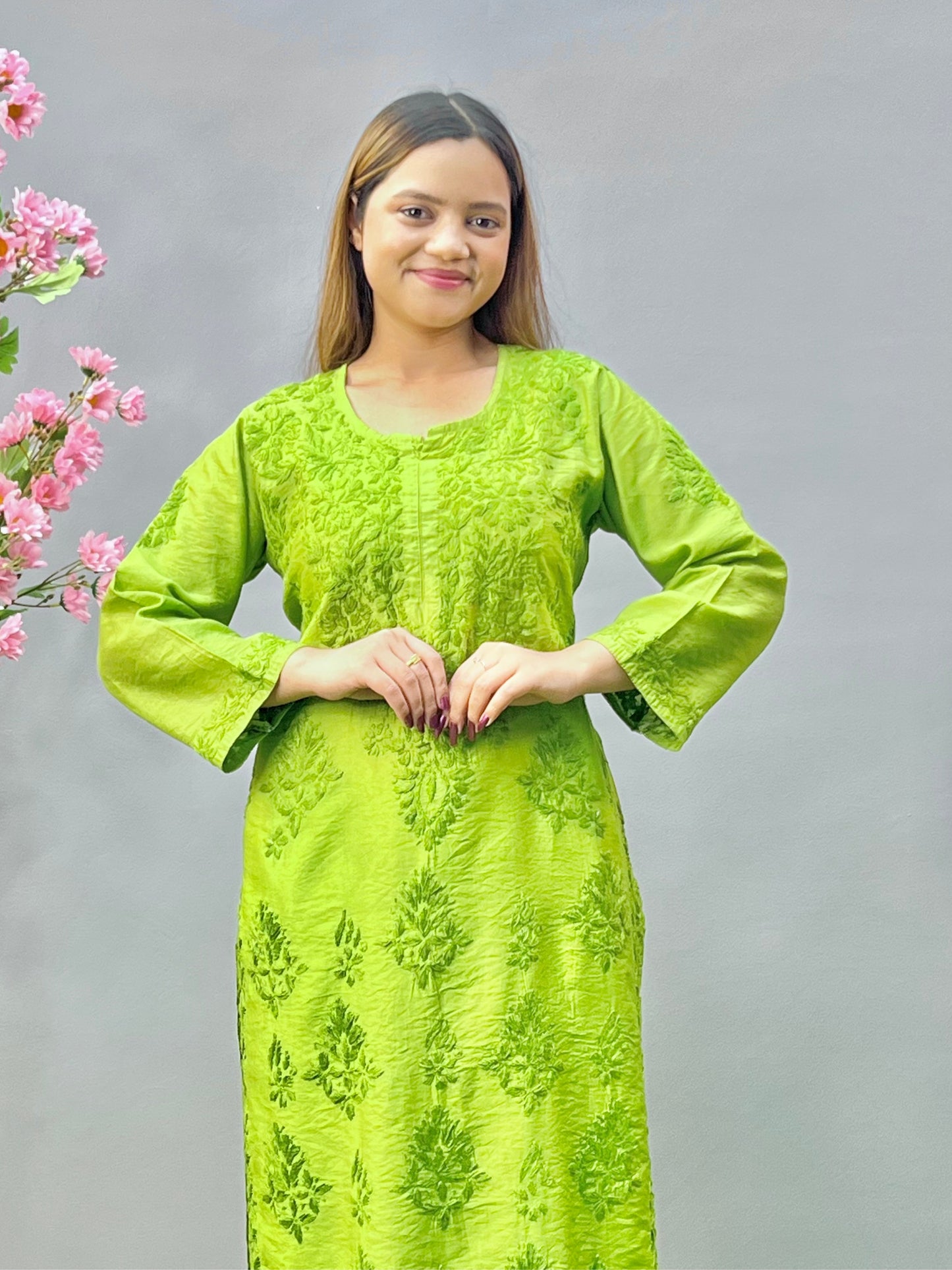 Woman wearing a premium lime green Chanderi Lucknowi Chikankari straight cut kurta with tone-on-tone embroidery, full sleeves, by R S CHIKANKARI.