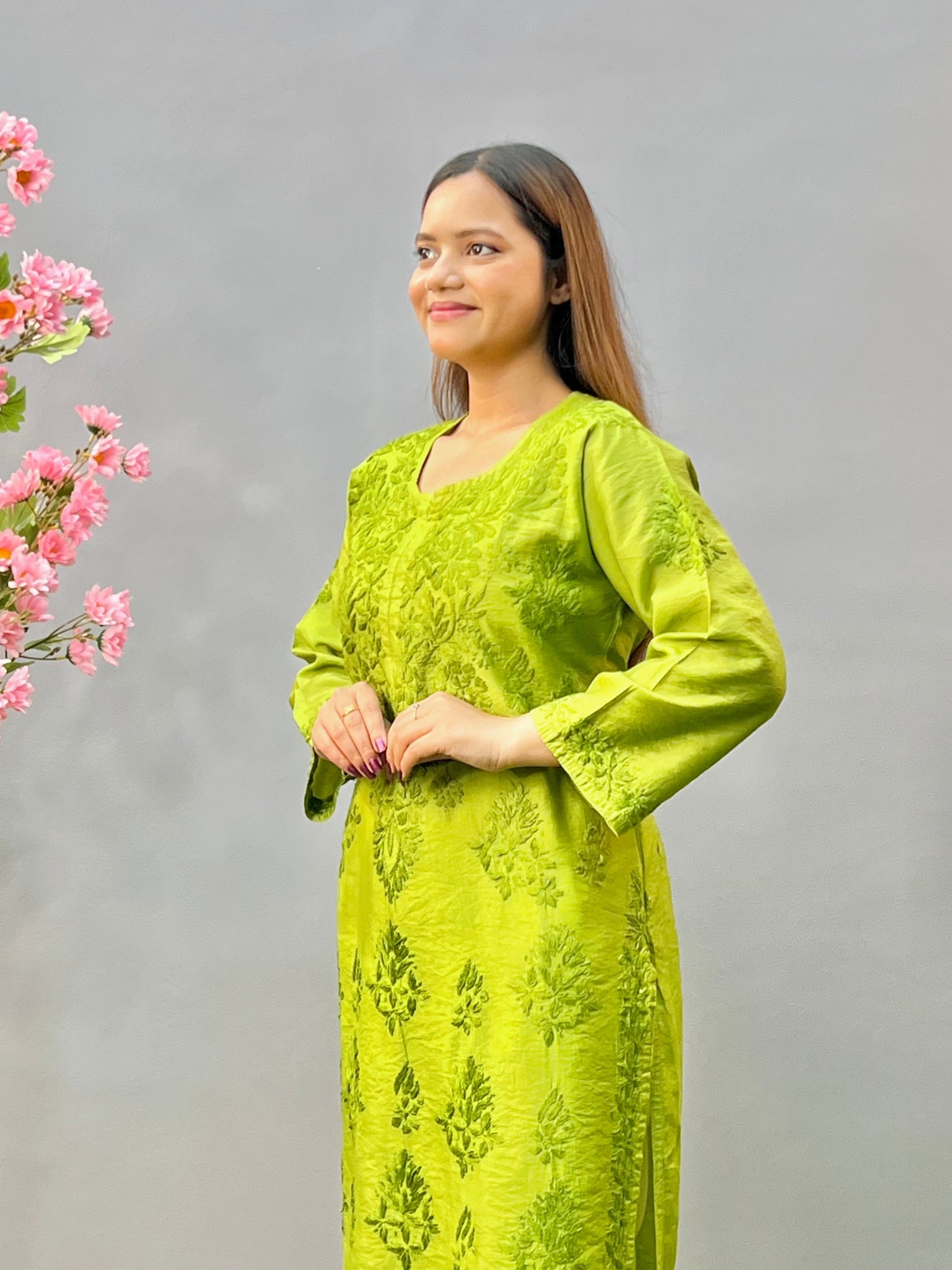 Woman wearing a premium lime green Chanderi Lucknowi Chikankari straight cut kurta with tone-on-tone embroidery, full sleeves, by R S CHIKANKARI.