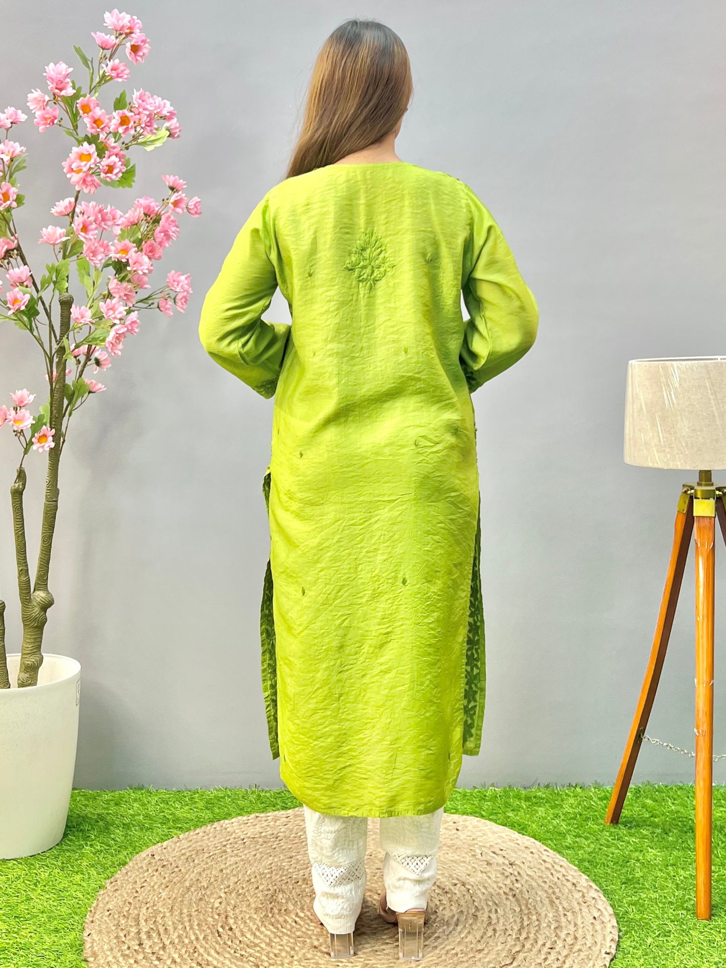 Woman wearing a premium lime green Chanderi Lucknowi Chikankari straight cut kurta with tone-on-tone embroidery, full sleeves, by R S CHIKANKARI.