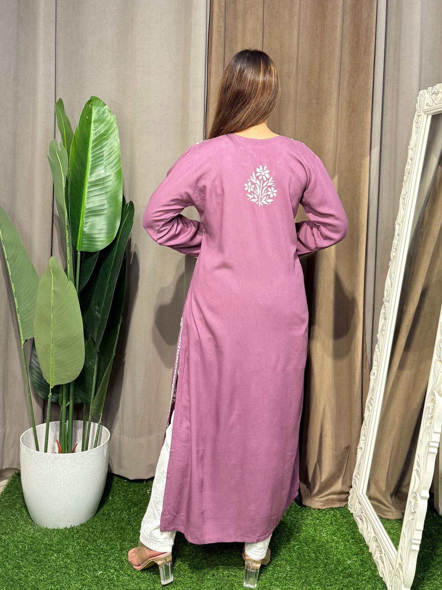 Woman wearing a premium plum mauve rayon Lucknowi Chikankari straight cut kurta with white embroidery, full sleeves, by R S CHIKANKARI.