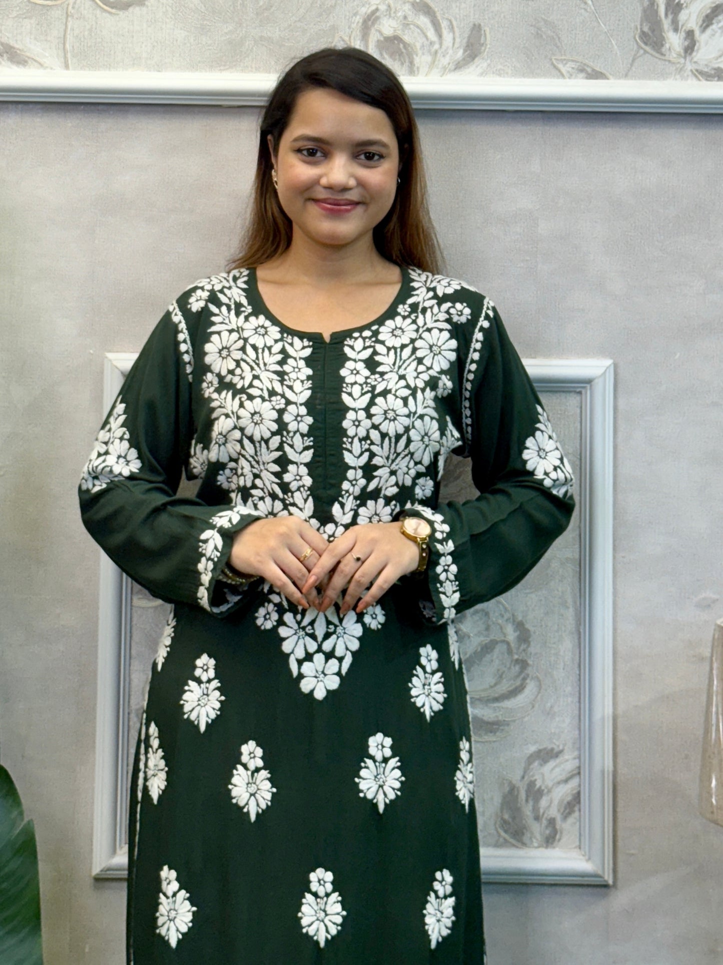 Dark green Lucknow Chikankari kurta and palazzo set in modal fabric with white hand embroidery.