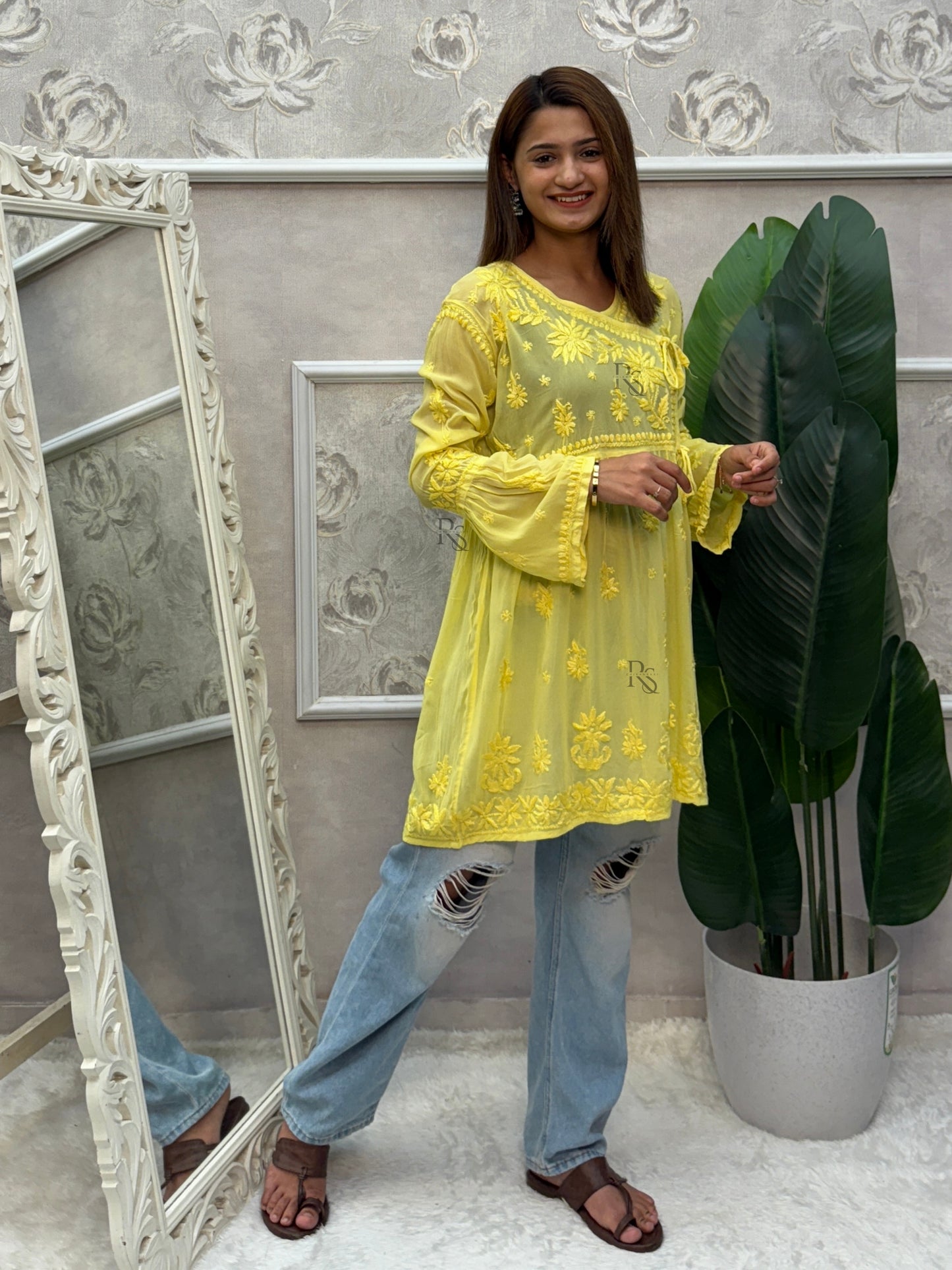 Yellow short angrakha style Lucknow Chikankari kurta in viscose fabric with hand embroidery.