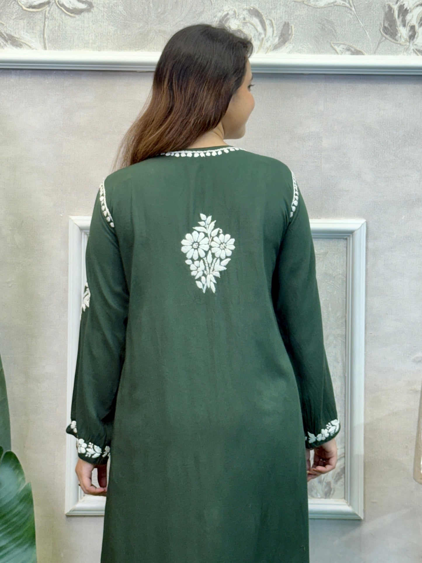 Dark green Lucknow Chikankari kurta and palazzo set in modal fabric with white hand embroidery.