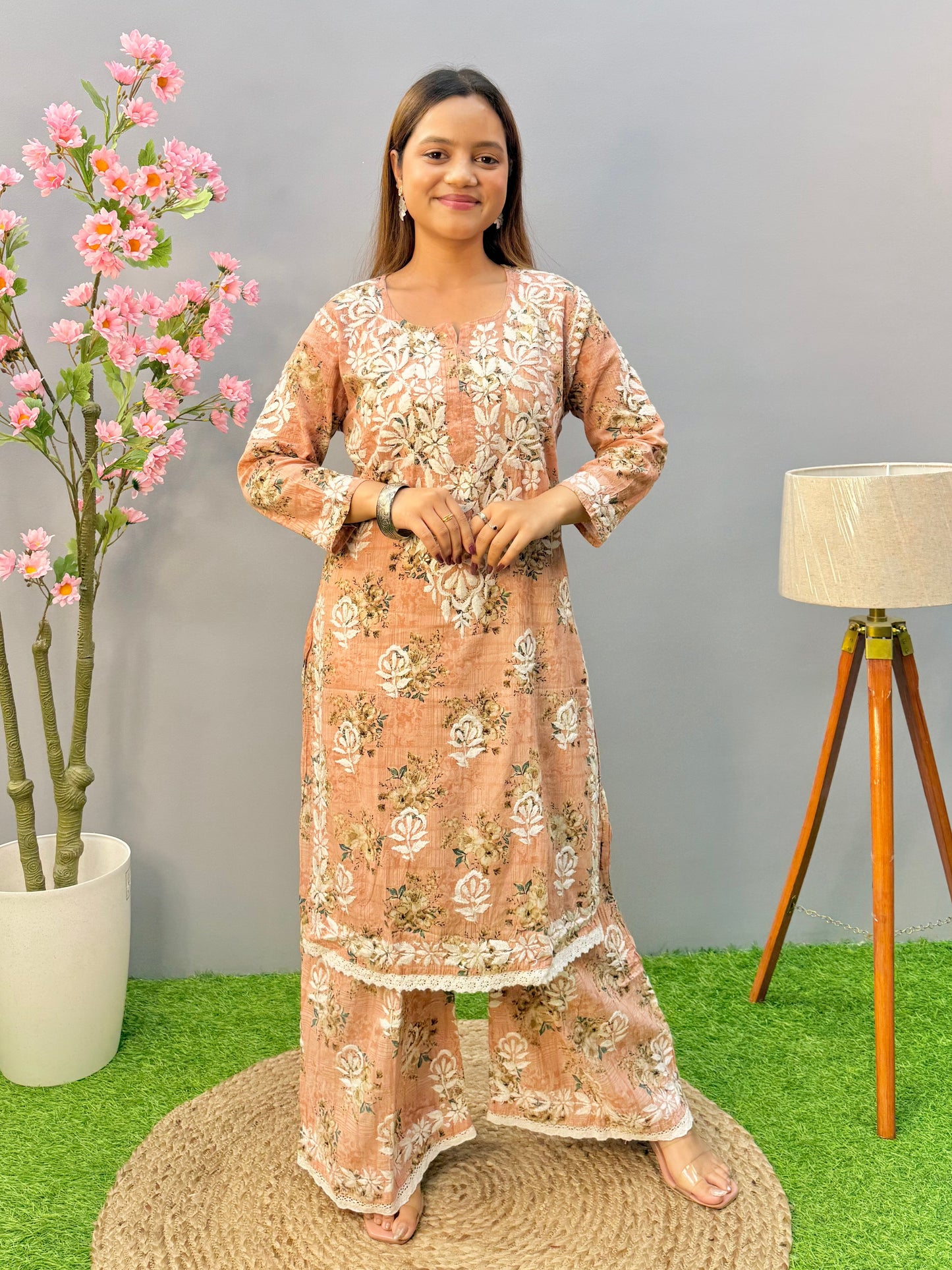 Warm peach printed Lucknow Chikankari mulmul kurta palazzo set with lace detailing
