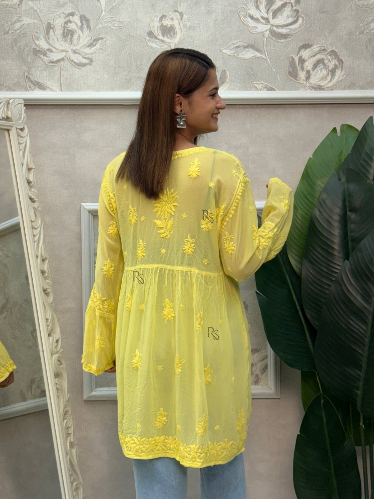 Yellow short angrakha style Lucknow Chikankari kurta in viscose fabric with hand embroidery.