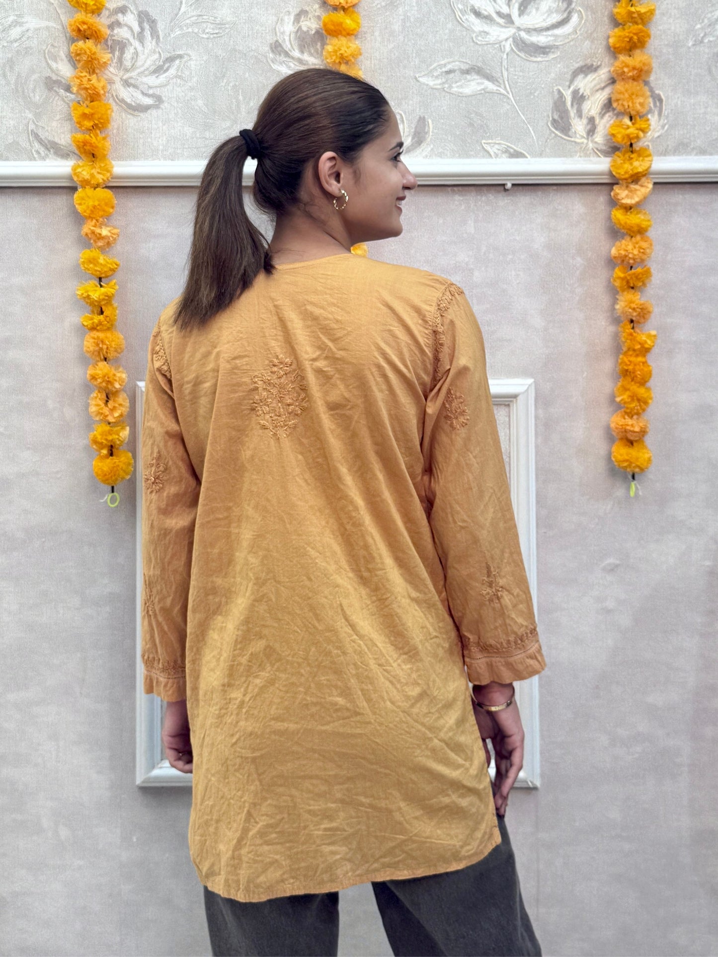Mustard cotton short chikankari kurta with hand embroidery and both side pockets
