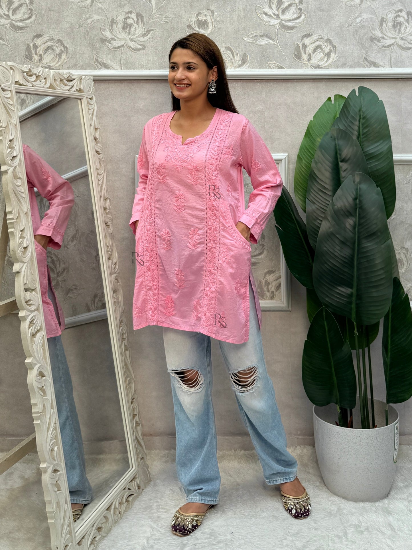 Pink cotton chikankari short kurta with hand embroidery and pockets.