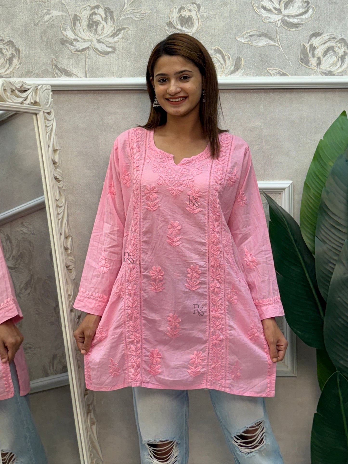 Pink cotton chikankari short kurta with hand embroidery and pockets.