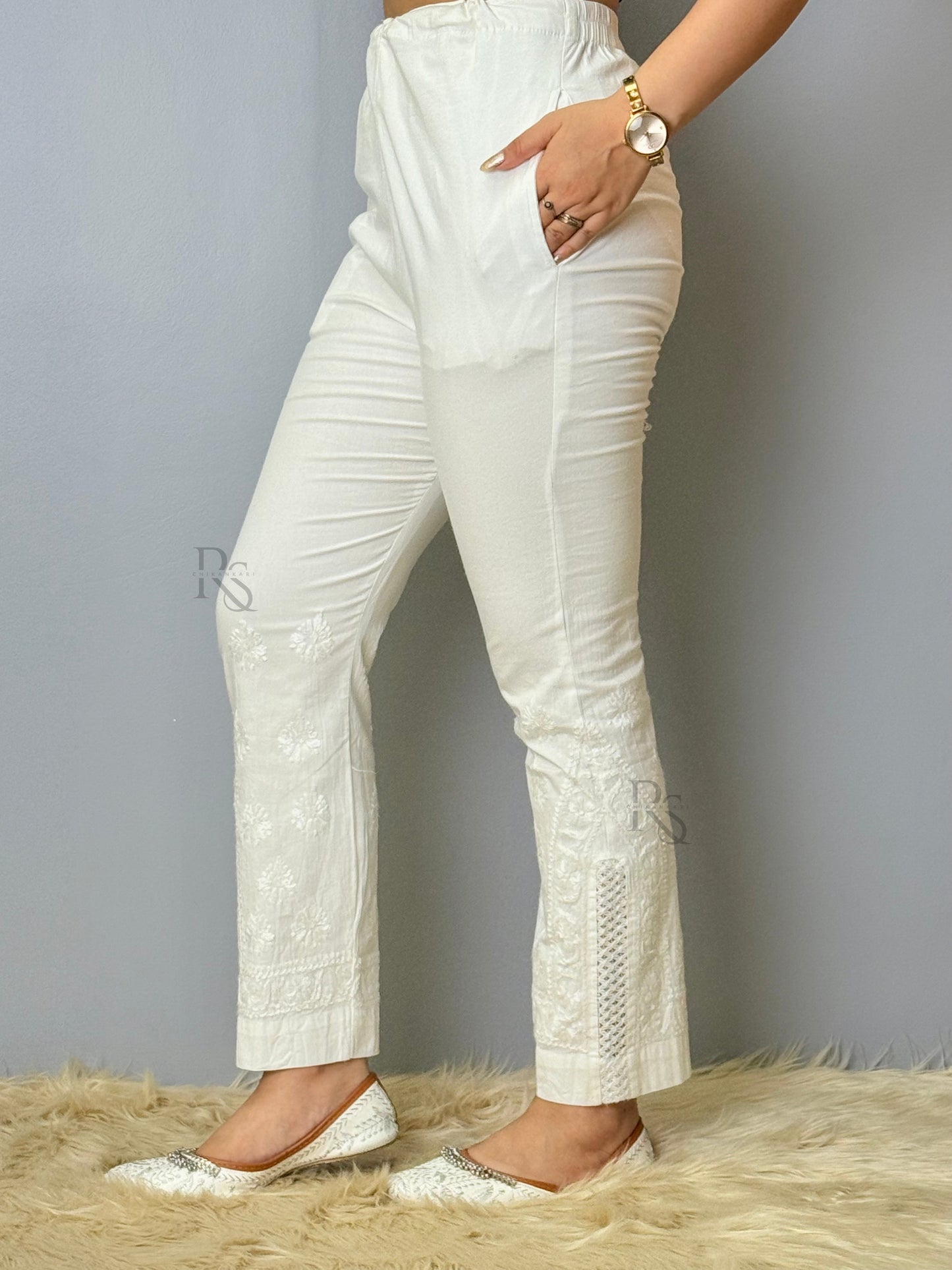 White stretchable cotton chikankari pant with hand embroidery and lace detailing