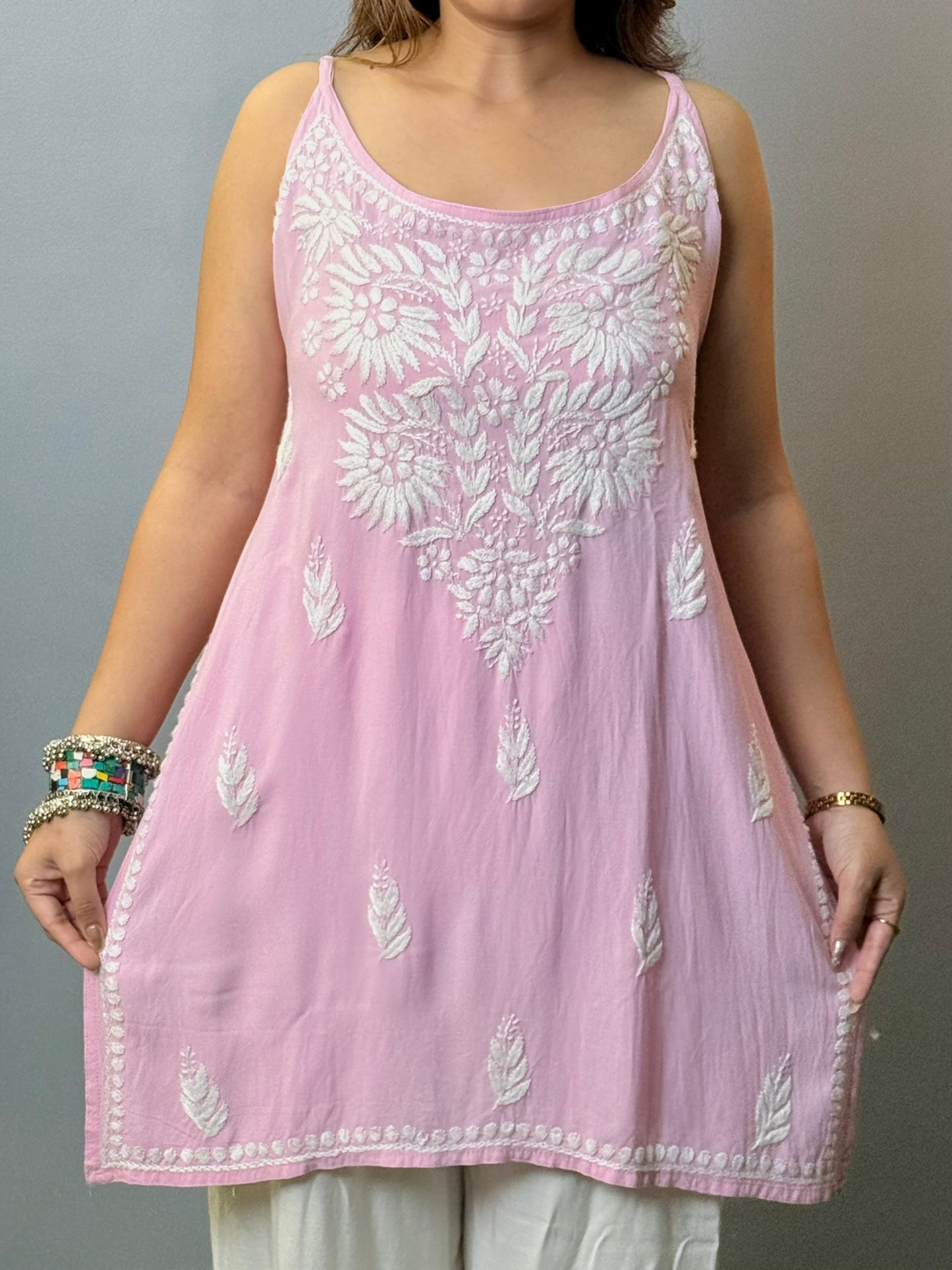 Baby pink sleeveless rayon Lucknowi Chikankari short kurta with white hand embroidery