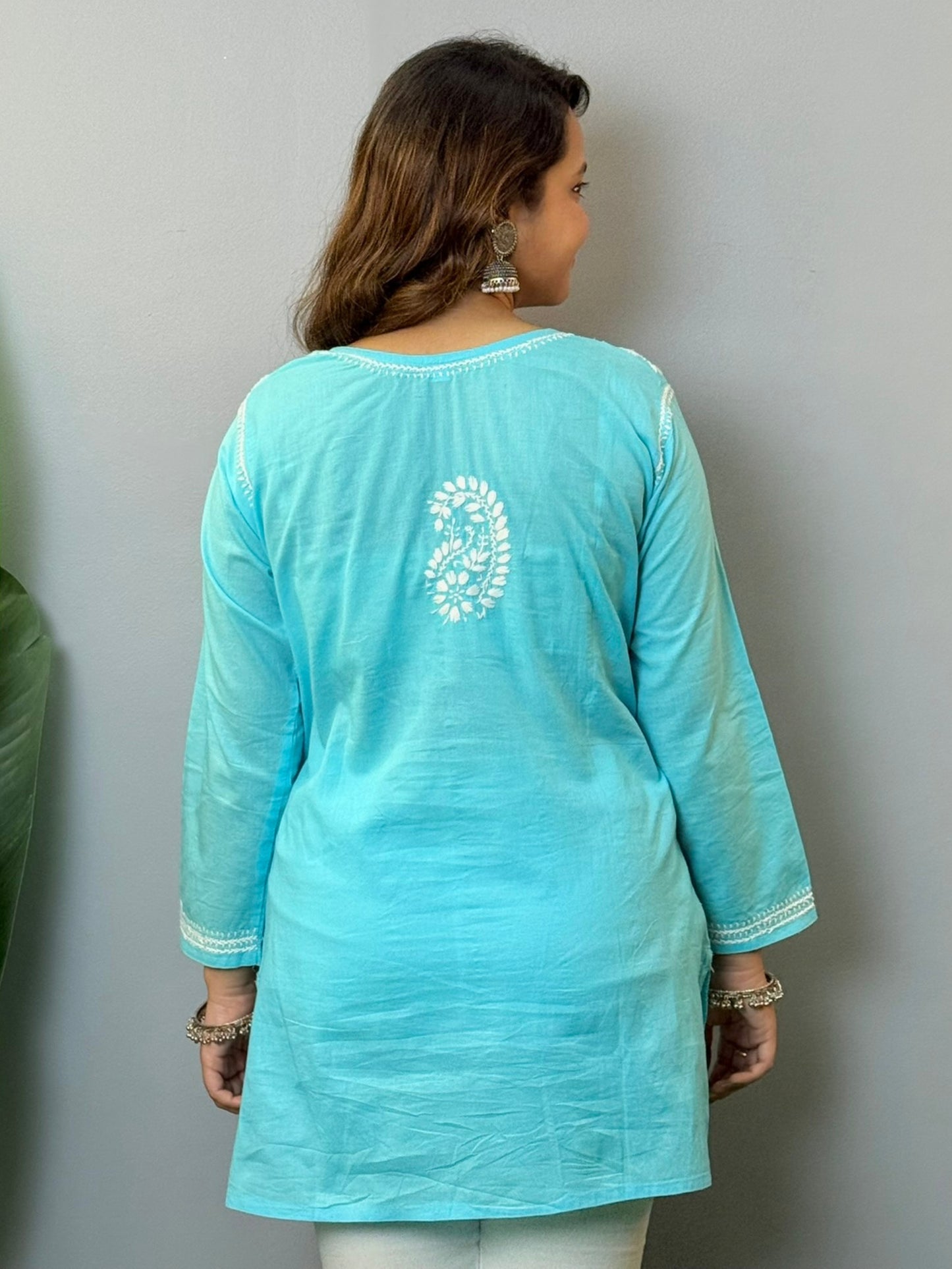 Sky blue cotton short chikankari kurta with white hand embroidery, styled for casual wear