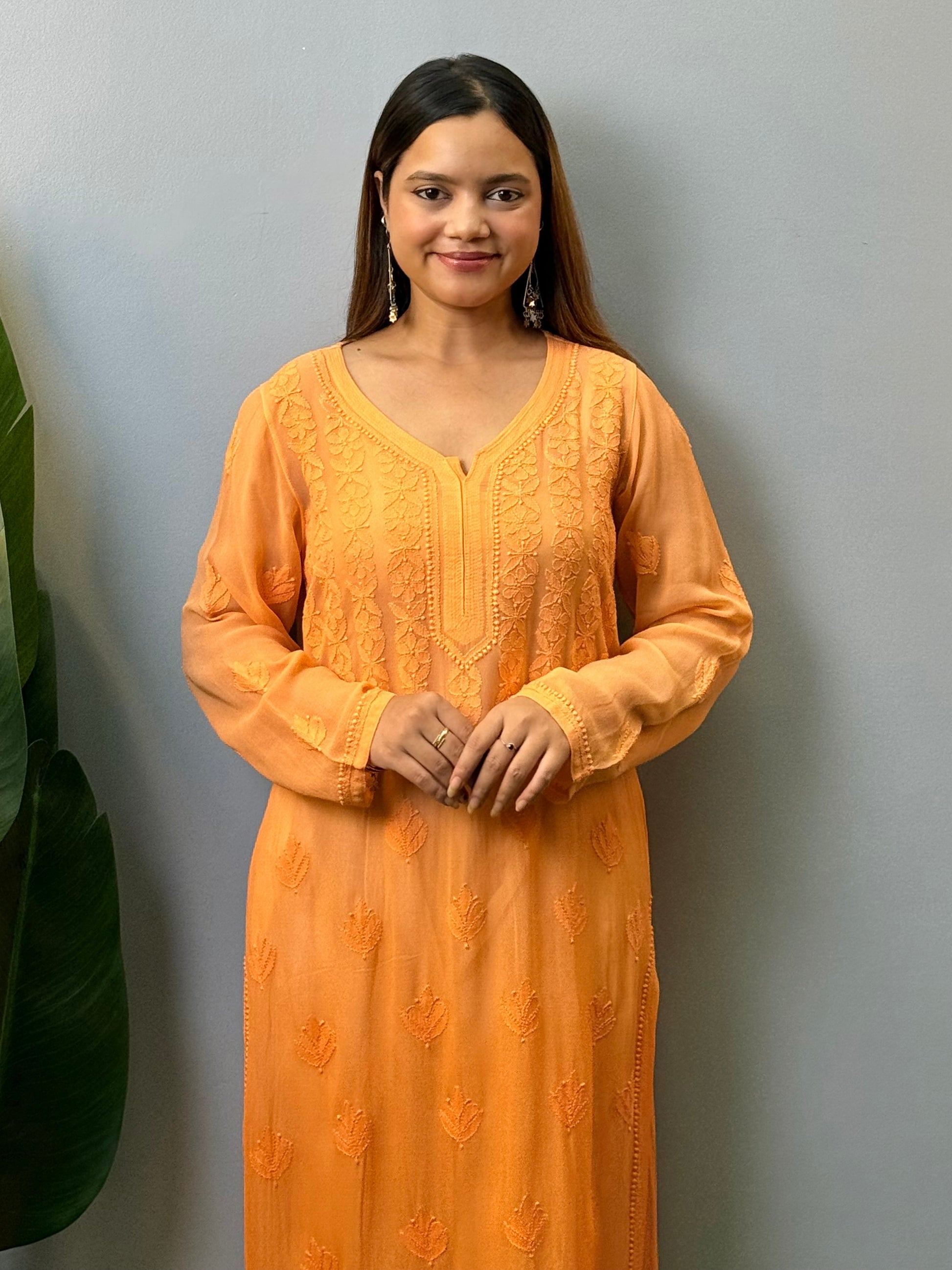 Orange viscose Lucknow Chikankari kurta with intricate hand embroidery, elegant and comfortable ethnic wear.