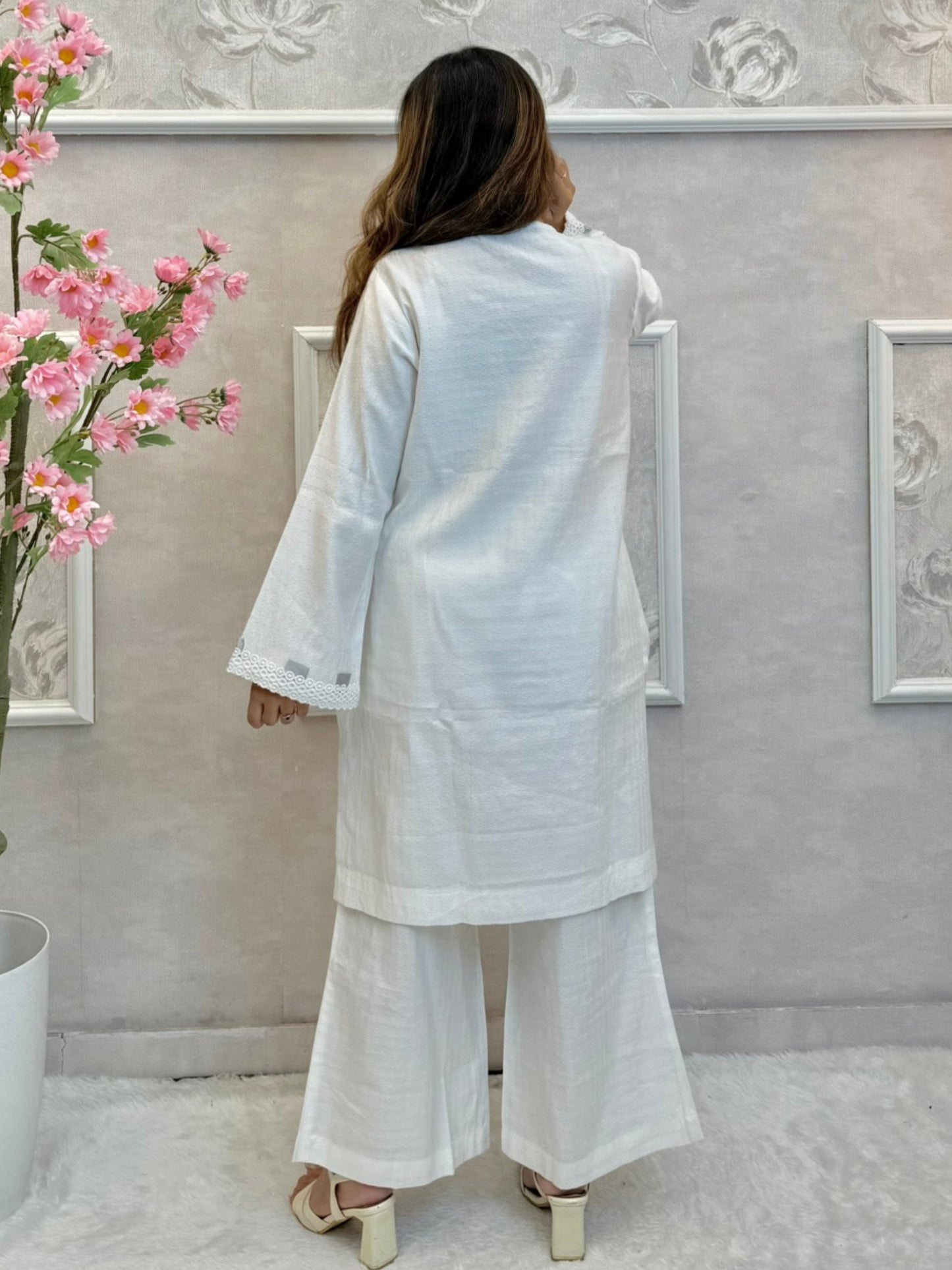 White premium rayon co-ord set featuring handwork on short kurta top with flared palazzo pants – stylish and elegant