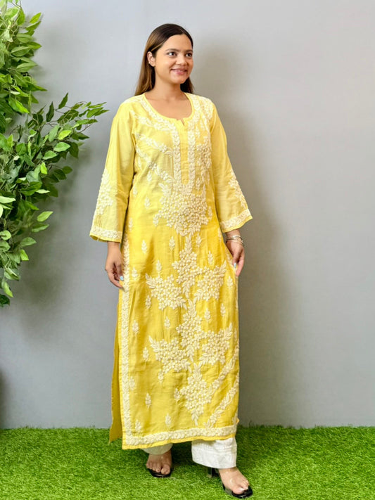 Model wearing a yellow ombre chanderi chikankari kurta with intricate 3D hand embroidery