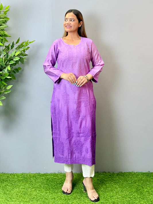 Model wearing a purple Chanderi Lucknowi chikankari kurta with subtle embroidery, styled with white palazzo pants.