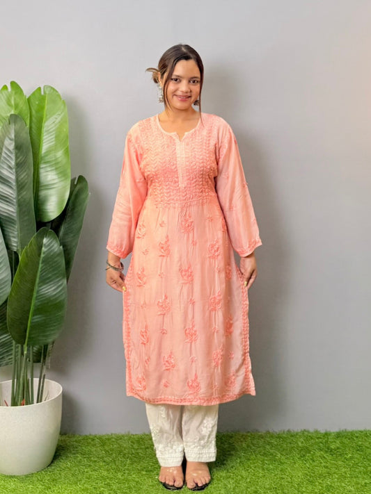 Model wearing peach muslin chikankari kurta with white bottom