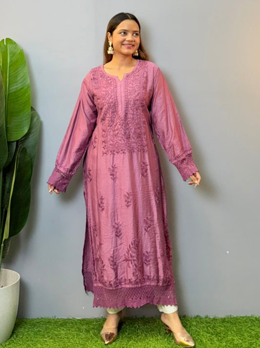 Woman wearing a plum Chanderi Chikankari kurta with hand embroidery and lace detailing, styled with white palazzo pants