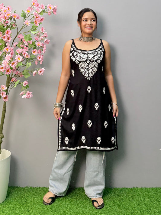 Black sleeveless rayon chikankari short kurta with white hand embroidery, soft and comfortable.