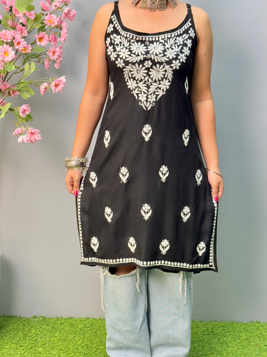 Black sleeveless rayon chikankari short kurta with white hand embroidery, soft and comfortable.