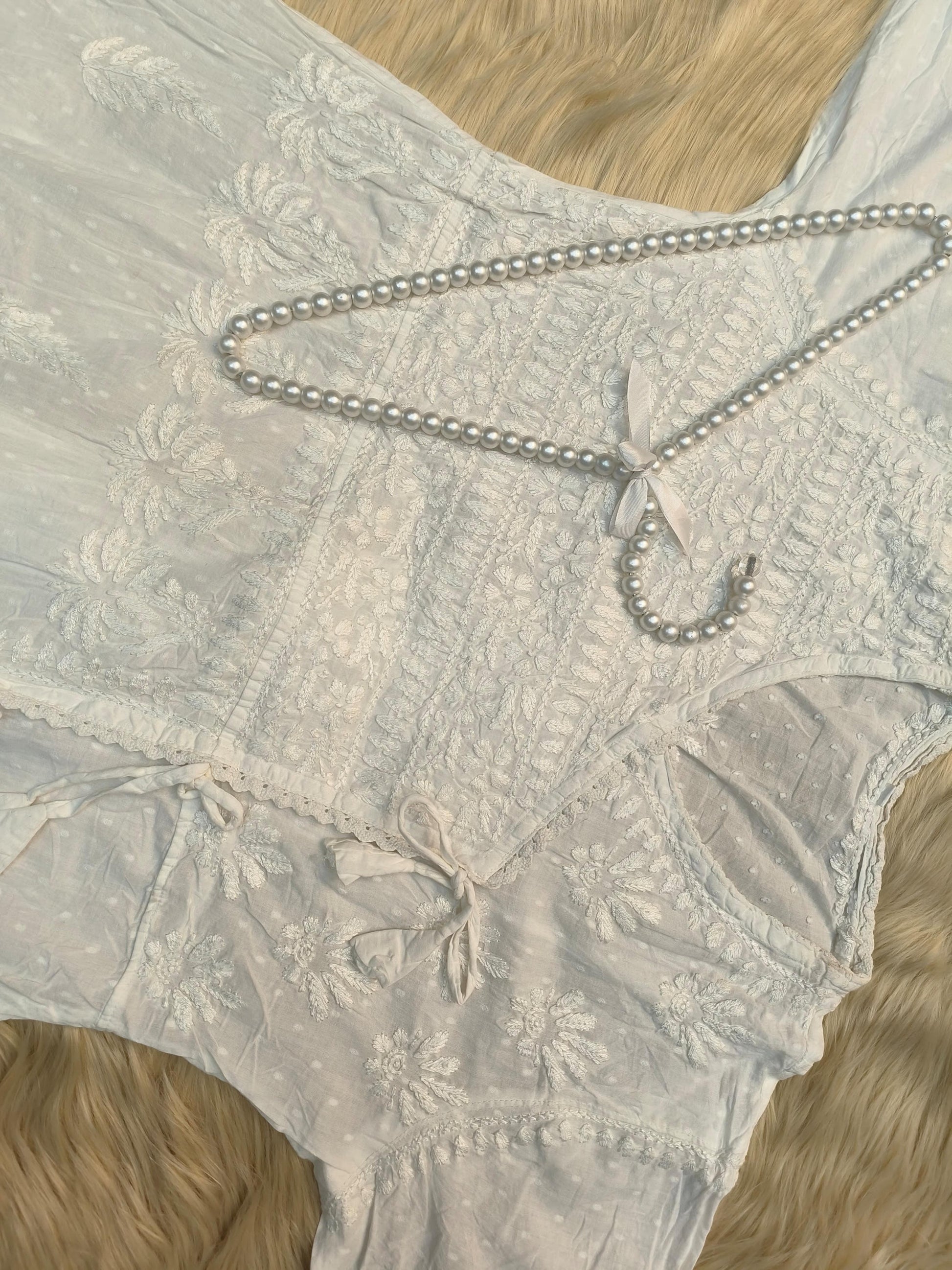 White dobby cotton angrakha chikankari kurta with side tie and hand embroidery