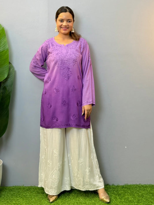 Woman wearing purple short modal chikankari kurta with matching hand embroidery, paired with white palazzo