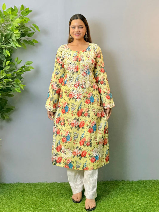 Woman wearing lemon yellow floral printed mulmul chikankari kurta with white embroidery