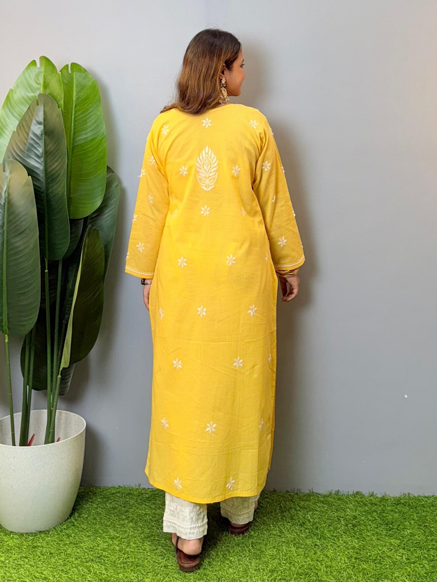 Yellow cotton Lucknow Chikankari kurta with hand embroidery and straight-fit design.