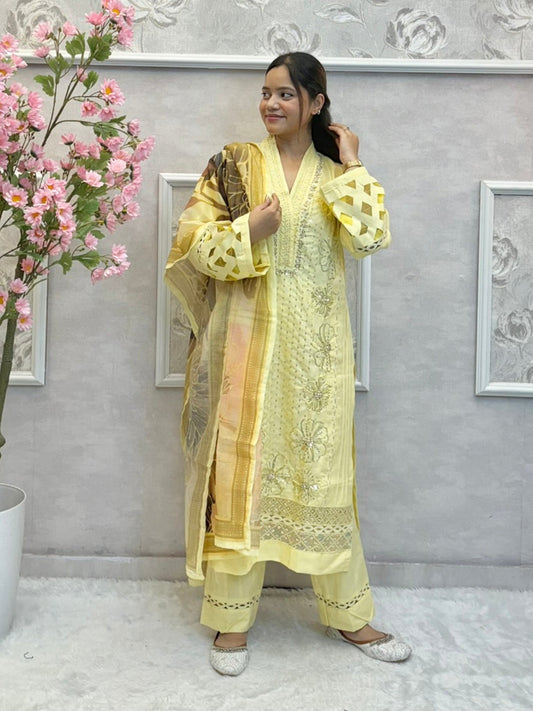 Lemon yellow rayon kurta set with hand embroidery and mirror work, printed dupatta, and matching pants
