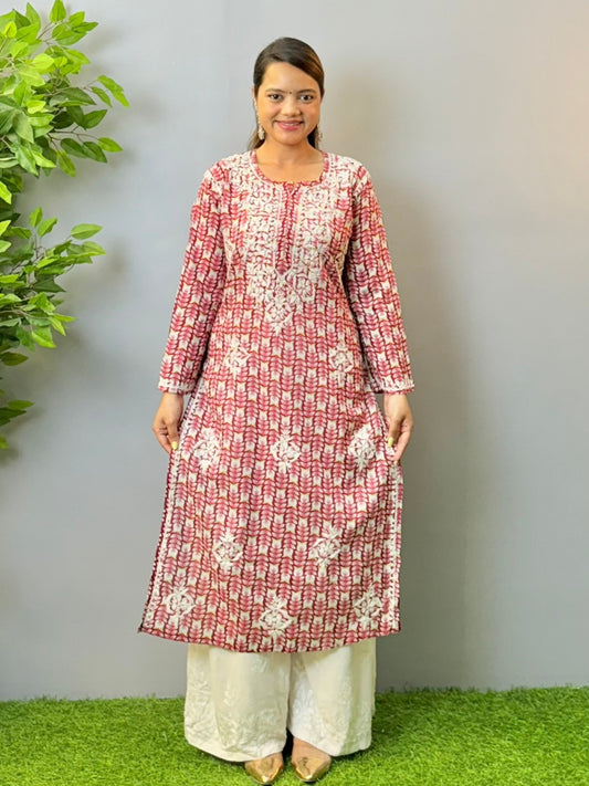 Woman in maroon printed mulmul chikankari kurta with white thread embroidery
