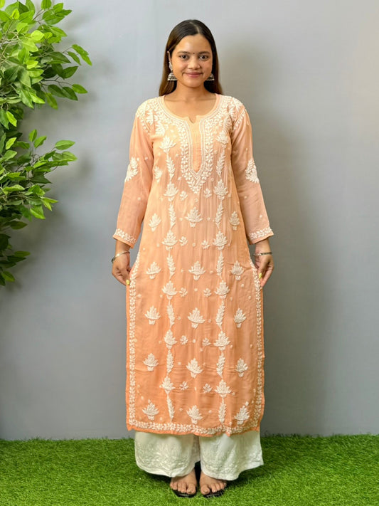 Woman wearing peach ombré viscose Chikankari kurta with white embroidery