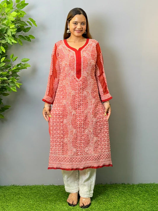 Woman wearing tomato red georgette chikankari kurta with heavy white embroidery