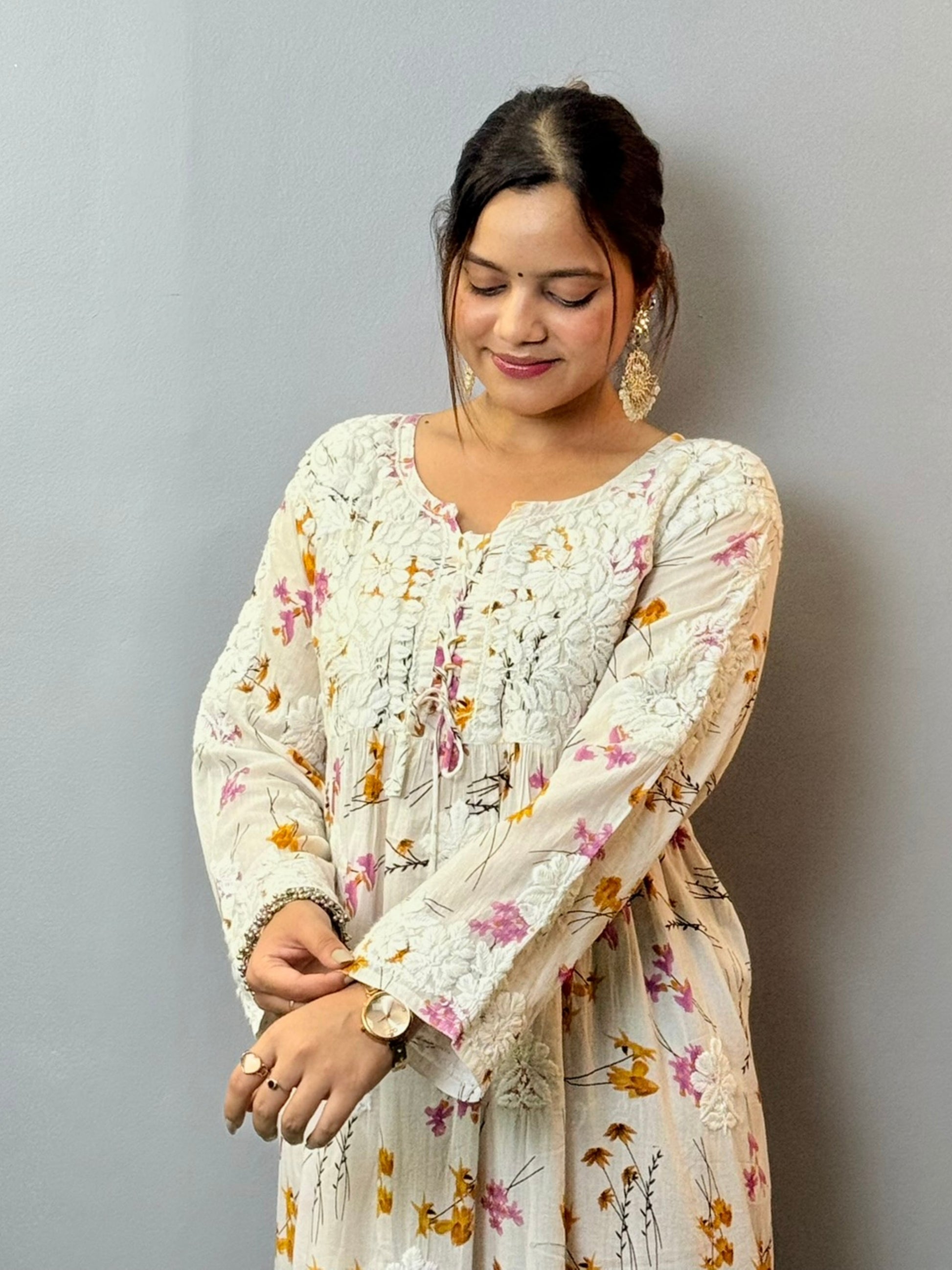 Floral printed mulmul Chikankari frock with 3D hand embroidery in off-white, pink, and yellow tones
